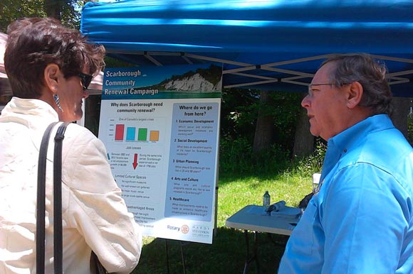 Scarborough Community Renewal Campaign Coordinator Dave Hardy chats with a local resident about the 